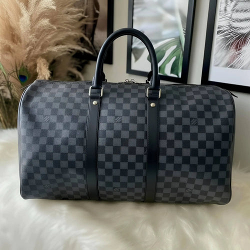 Checkered leather duffle bag