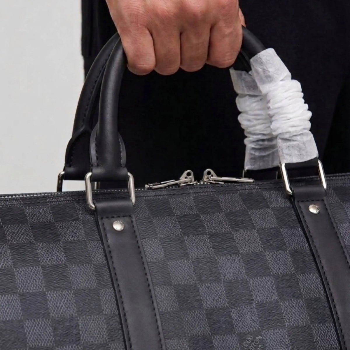 Checkered leather duffle bag