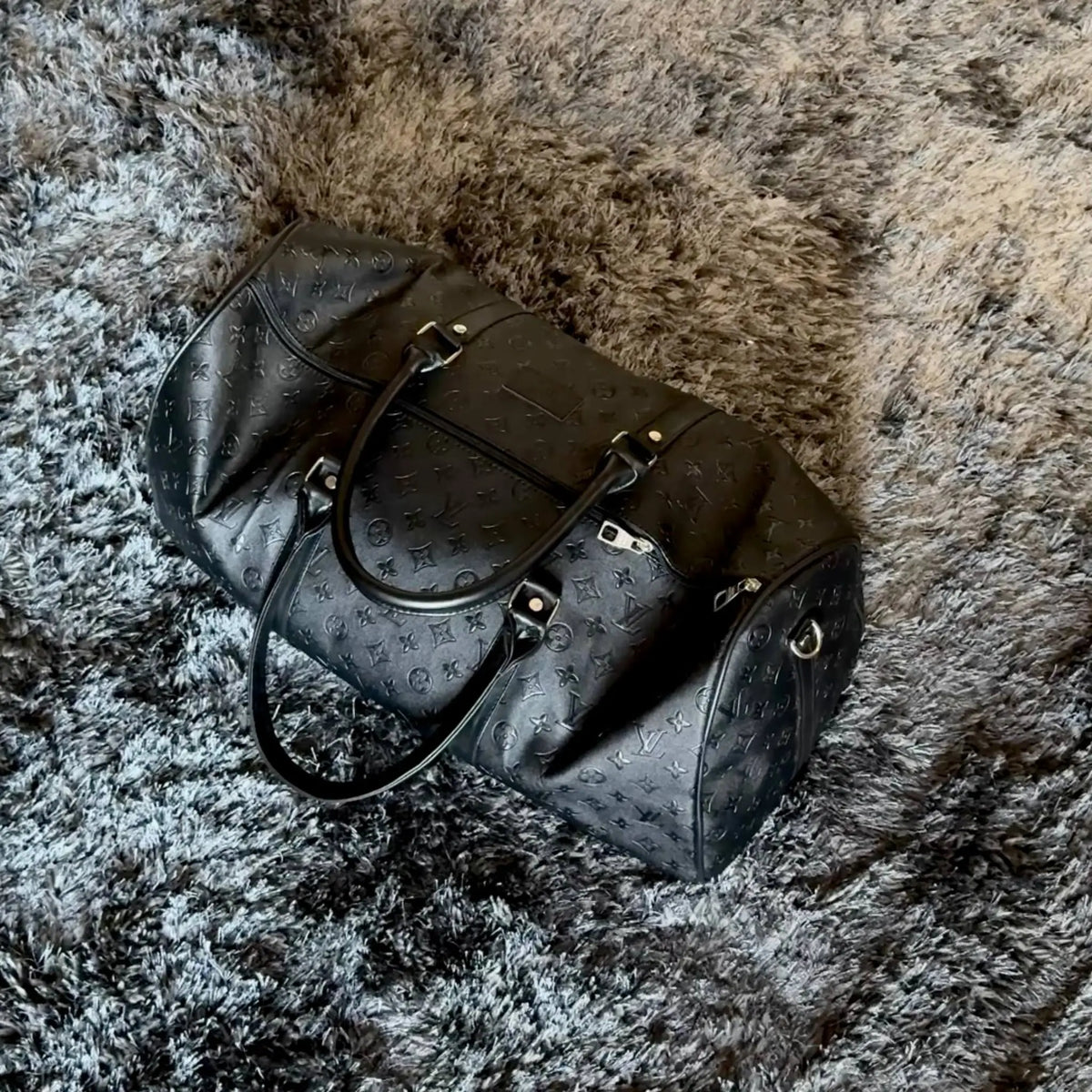 LV leather duffle bag