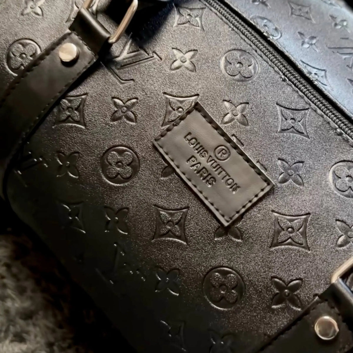 LV leather duffle bag